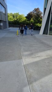 Walk around the left side of the tall building